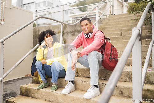 Image of Portrait, stairs and students with a man and black woman sitting outdoor on campus together at university for education. Scholarship, college and school with a male and female pupil seated on steps