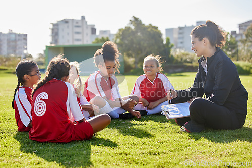 Image of Clipboard, soccer or coach with children planning for strategy, training or sports goal in Canada. Team building, friends and woman coaching group of girl on football field for game, match or workout