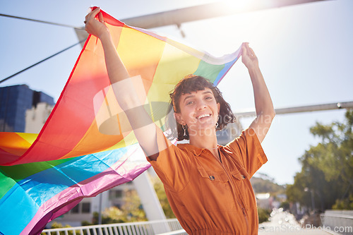 Image of Portrait, pride and woman with smile and flag for lgbtq community, ally or lesbian with support and equality in love. Rainbow, parade outdoor and lgbt awareness, inclusion celebration and sexuality