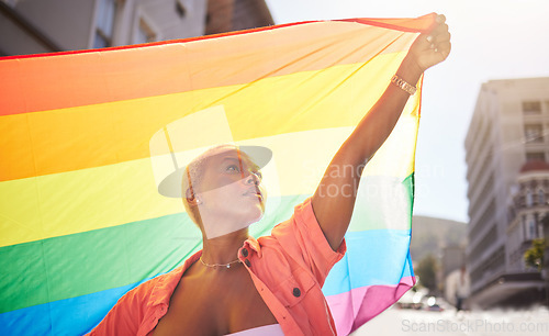 Image of Lesbian, pride and black woman in city with flag for lgbtq community, ally or gay with support and equality in love outdoor. Rainbow, parade and lgbt awareness, inclusion and celebrate with sexuality