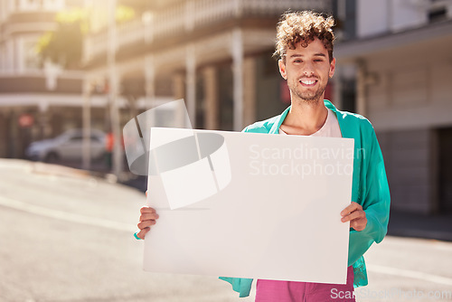 Image of Mockup, portrait and man with board, street and protest for human rights, social change and equality. Young person, male and protester with blank card, marching and in city with smile and activist