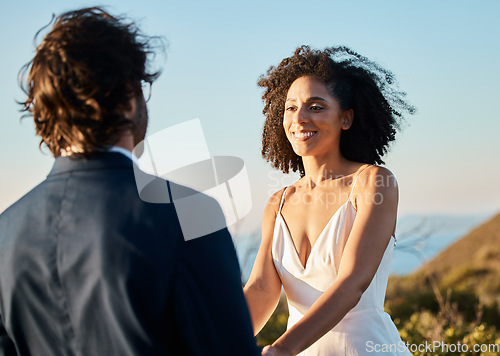 Image of Wedding, smile and couple holding hands at beach in Hawaii on special day in summer. Love, romance and groom groom happy bride in luxury designer dress at outdoor marriage ceremony on tropical island