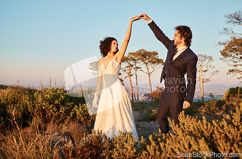 Image of Love, wedding and holding hands for dance with couple in nature park for celebration, romance and happiness. Sunset, support and summer with bride and groom for marriage, ceremony and bonding