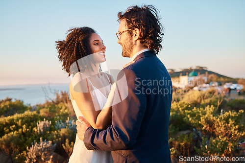 Image of Love, happy and wedding with couple in nature for celebration, happiness and romance. Sunset, hug and affectionate with man and woman in embrace at countryside for ceremony, marriage and smile