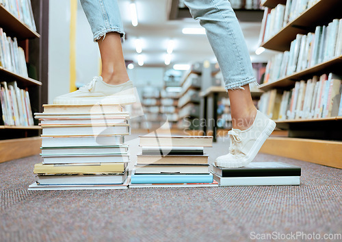 Image of Woman feet, book steps and library for symbol of progress in learning, education and development for study goals, University student, cropped and shoes with paper stairs on floor to success vision