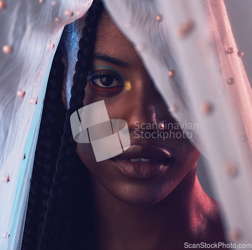 Image of Portrait, beauty and makeup with a model black woman in studio on a gray background covered with fabric. Face, cosmetics and textile with an attractive young female posing to promote natural skin