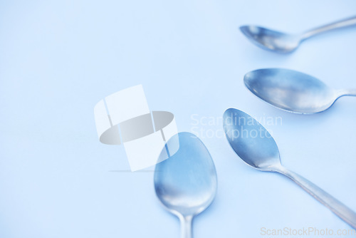 Image of Kitchen, cutlery and spoon on a table as a group with mockup to represent community, charity or donation. Cooking, metal and space with steel utensils on a surface from above to volunteer or donate