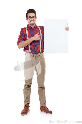 Image of Businessman, portrait and pointing to blank, paper or billboard in studio, space and white background. Face, employee and man with advertising, poster and marketing mockup while standing isolated