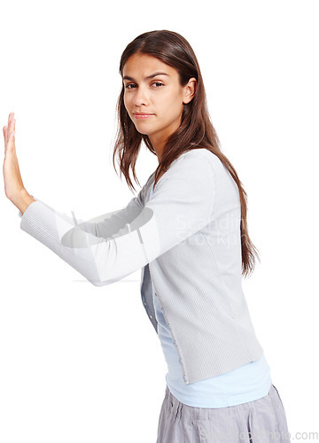 Image of Portrait, push and mockup with a woman in studio isolated on a white background for effort or moving. Mock up, poster or billboard with an attractive young female pushing blank space for presentation