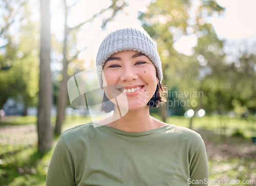 Image of Nature, smile and portrait of Asian woman in forest for adventure, freedom and hiking for fitness. Wellness, relax and face of girl enjoying fresh air, peace and woods for exercise, cardio and hike