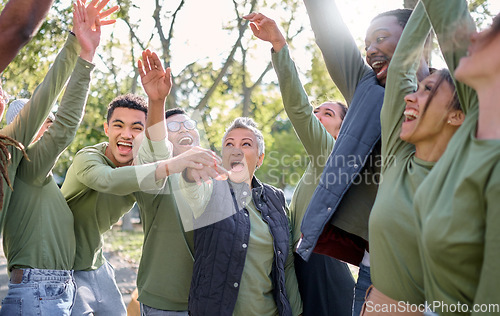 Image of Team celebration, hands in air and volunteer group in nature with diversity and happiness. Community teamwork, motivation and collaboration of people in a park for sustainable work outdoor together