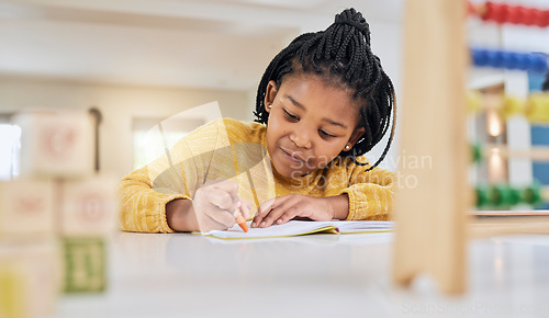 Image of Education, girl and child writing at table for homework, lesson and home school activity in her house. Learning, student and child development, student and distance learning, focus and drawing