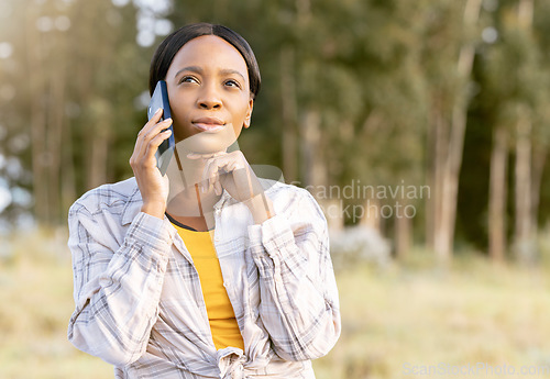Image of Black woman, phone and thinking on call in nature for communication, travel or cellular 5G service outdoors. African American female contemplating trip, traveling or decision on smartphone