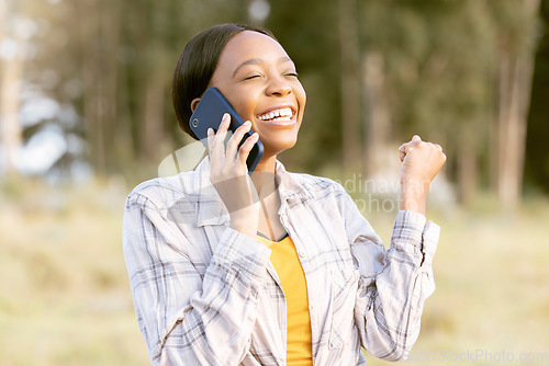 Image of African woman, celebrate and fist with phone call, outdoor or smile for winning, success or goal in summer. Adventure, smartphone conversation or good news for girl in sunshine, forest or celebration