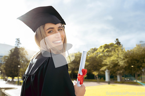 Image of Woman, student and smile for graduation, diploma or achievement in higher education. Portrait of happy female academic learner holding certificate, qualification or degree for university scholarship