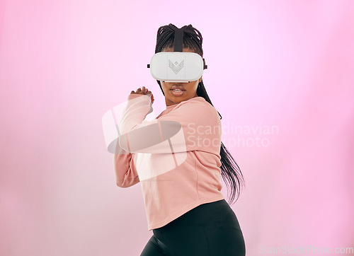 Image of Black woman, VR and gamer in the metaverse for futuristic gaming or activity against a pink studio background. African American female in 3D virtual reality game with headset in the future on mockup