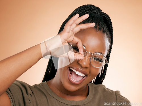 Image of Black woman, portrait smile and ok hand sign for perfect, great or right against studio background. Happy African American female smiling in happiness showing okay emoji gesture for positive attitude