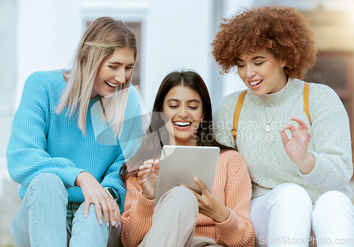 Image of Student, friends and tablet laughing for entertainment streaming, social media or communication at campus. Happy women enjoying funny meme, laugh or browsing online research on touchscreen together