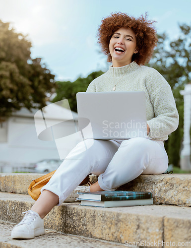 Image of Laptop, college and portrait of a woman student in the city sitting on the stairs studying for test or exam. Education, university and young female from Brazil working on academic project on computer
