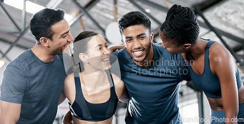 Image of Diversity, fitness and team building for exercise, workout or training together at the indoor gym. Happy diverse group of people smile in sports teamwork, huddle or hug for healthy exercising support