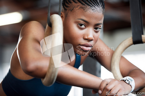 Image of Fitness, gymnastics and portrait of black woman with rings for training, exercise and workout at gym. Wellness, motivation and face of girl athlete with focus for competition, performance and sports