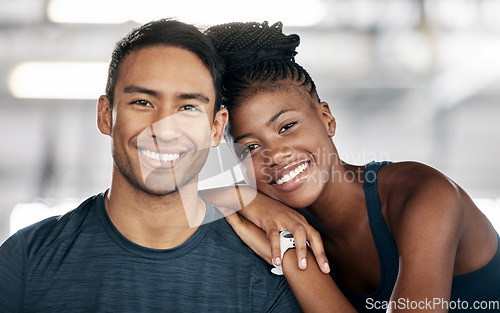 Image of Fitness, portrait or couple of friends at gym bonding and embrace or hug in training, exercise or workout. Team partnership, coach or happy black woman in smile with pride together in a health club