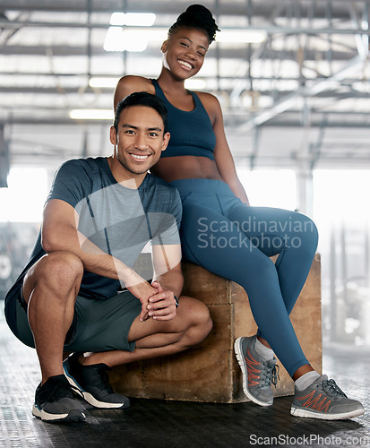 Image of Fitness, portrait or personal trainer with a happy client at gym for training, exercise or body workout. Team partnership, Indian coach or black woman smiles with pride together in a health club