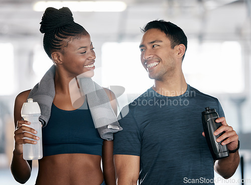 Image of Fitness, black woman or personal trainer drinking water in training, workout or exercise on relaxing break. Coaching, partnership or sports athletes with healthy liquid for hydration or energy at gym