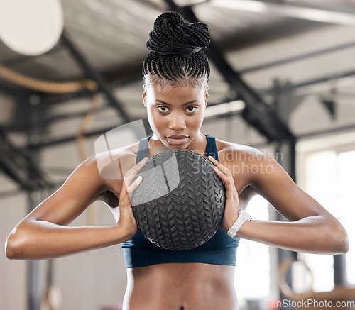 Image of Portrait, medicine ball or black woman in training, workout or exercise for balance or strengthen muscles. Focused girl, mindset or healthy African athlete with goals, motivation or focus at gym