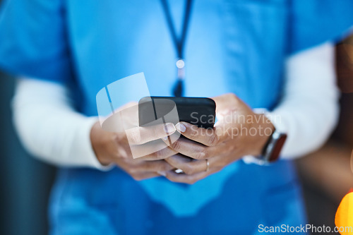 Image of Phone, hands and medical nurse in hospital working on telehealth, research or online consultation. Healthcare smartphone, woman and female physician with mobile for wellness app in clinic at night.