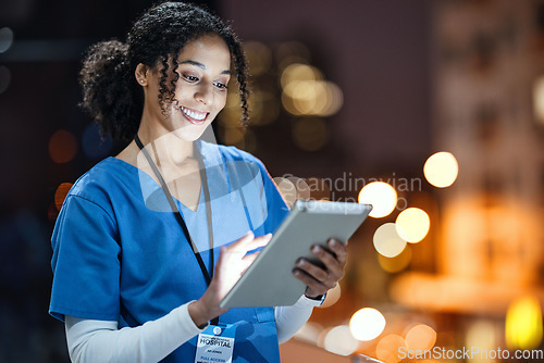 Image of Medical, research and night with doctor and tablet for planning, medicine and schedule. Technology, review and digital with black woman reading report for healthcare, science and life insurance news