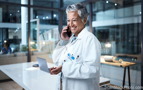 Image of Doctor, senior woman and phone call in hospital conversation, talking and networking. Smartphone, night and female medical physician in discussion, telehealth or consulting for support in clinic.