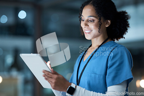 Image of Tablet, medical nurse and black woman in hospital working on telehealth, research or online consultation. Bokeh, healthcare and female physician with technology for wellness app in clinic at night.