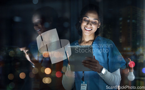 Image of Medical, research and night with doctor and tablet for planning, medicine and schedule. Technology, review and digital with black woman reading report for healthcare, science and life insurance news