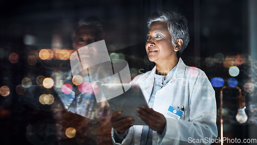 Image of Healthcare, tablet and thinking with a doctor woman at night, working overtime in the evening after dark. Medical, research or idea and a mature female medicine professional at work with a cityscape