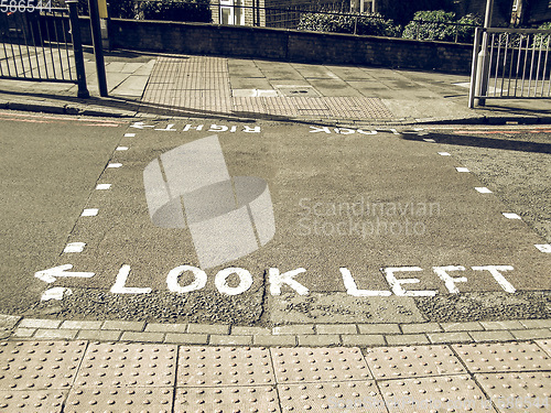 Image of Vintage looking Look right look left sign on London zebra crossi