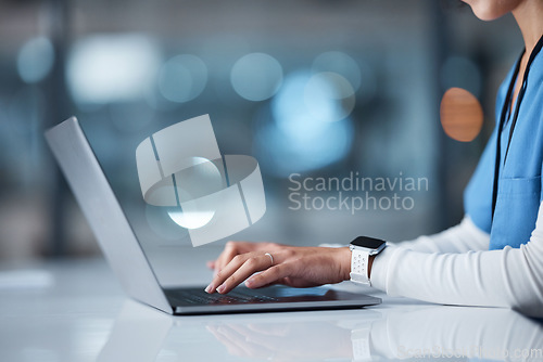 Image of Doctor, hands and laptop in healthcare research, browsing or searching online for medical data at night in a hospital. Hand of nurse typing on computer in communication, email or networking at clinic