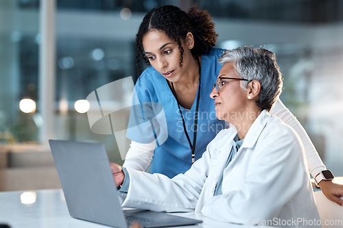 Image of Doctors, thinking or laptop in night teamwork, medical research or surgery planning in wellness hospital. Talking, nurse or healthcare women on technology for collaboration help or life insurance app