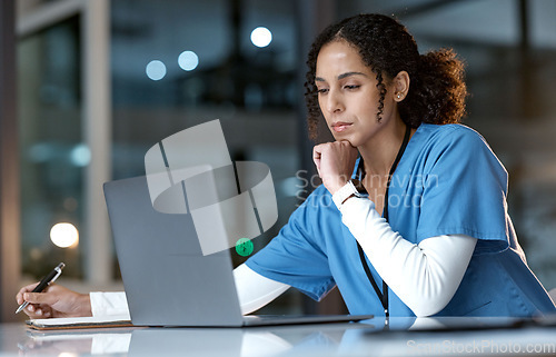 Image of Doctor, thinking and writing with laptop at night for healthcare solution, idea or planning at hospital. Woman medical nurse working late in focus for research with notebook and computer at clinic