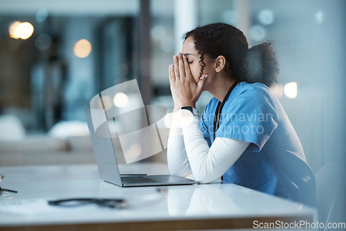 Image of Burnout stress, nurse and black woman in hospital feeling pain, tired or sick on night shift. Healthcare, wellness and female medical physician with depression or anxiety while working late on laptop