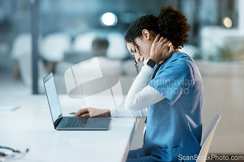 Image of Doctor, laptop and neck pain at night overworked, stressed or burnout by desk at the hospital. Woman medical professional suffering from painful injury, ache or inflammation working late on computer