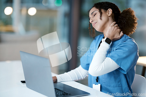 Image of Doctor, laptop and neck pain at night in agony, stressed or burnout by desk at the hospital. Woman medical professional suffering from painful injury, ache or inflammation working late on computer