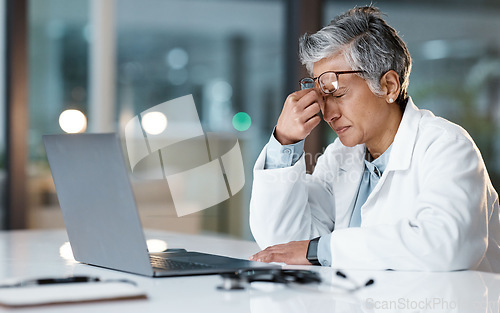 Image of Night, stress and headache with face of doctor for medical, thinking and deadline review. Burnout, compliance and mental health with black woman for healthcare, medicine and science research