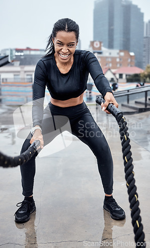 Image of Fitness, exercise and black woman with rope in city for cardio workout, training and sports wellness. Motivation, focus and portrait of female athlete with gear for strong muscles, power and energy