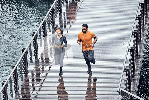 Image of Top view, run or couple training, seaside or workout for wellness, healthy lifestyle or practice together. Running, black man or woman with exercise, promenade or performance with endurance or energy