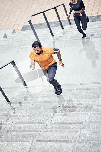 Image of Fitness, rain and people running outdoor for muscle wellness, music and energy in winter focus. Urban stairs, Black man, runner couple or personal trainer speed for cardio workout or exercise above