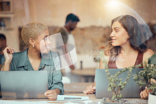 Image of Cafe, meeting and business women talking with laptop for b2b networking, discussion and conversation. Communication, collaboration and female workers working on project ideas, planning and strategy