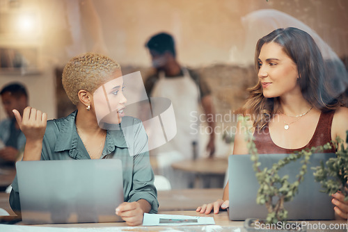 Image of Discussion, laptop and business women in cafe window for conversation, planning and b2b networking. Communication, teamwork and female workers talking for project ideas, strategy report and research