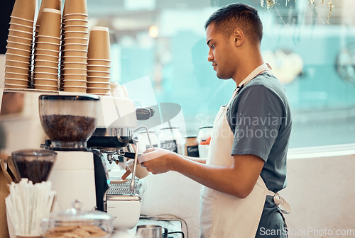 Image of Cafe, coffee machine and man barista working on a espresso or latte order in the restaurant. Morning, cafeteria and male waiter from Mexico preparing a caffeine or tea warm beverage in a coffee shop.