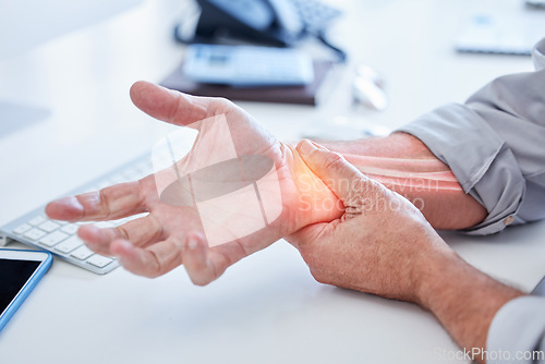 Image of Closeup, business and man with wrist pain, while working and overworked with muscle strain, office and injury. Zoom, male employee or consultant holding hand, suffering from arthritis or inflammation